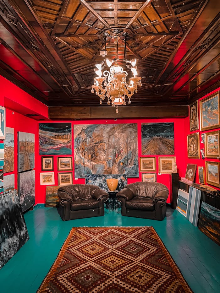 A luxurious art gallery room in Ankara, Turkey featuring rich decor and a central chandelier.