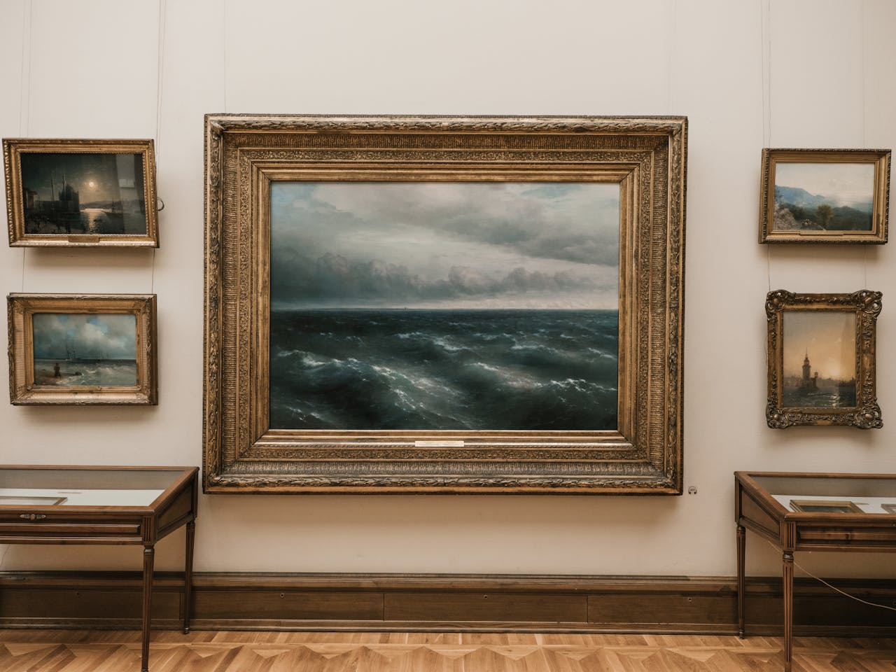Elegant seascape painting in a classic art gallery with vintage frames.